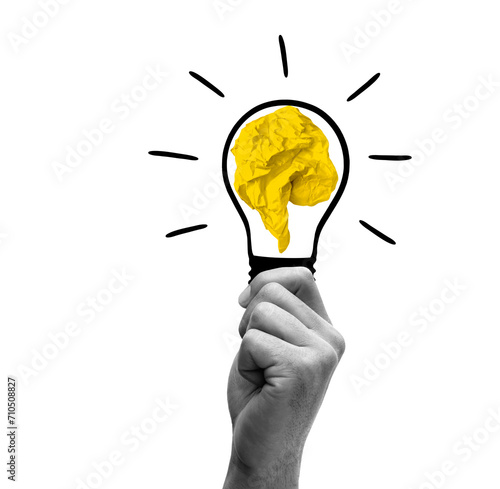 Zerknülltes Papier in einer Glühbirne als Ideenkonzept isoliert auf weissem H...