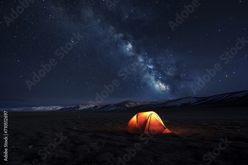 Alpine Camping under Stars. Tent in snowy landscape at night.