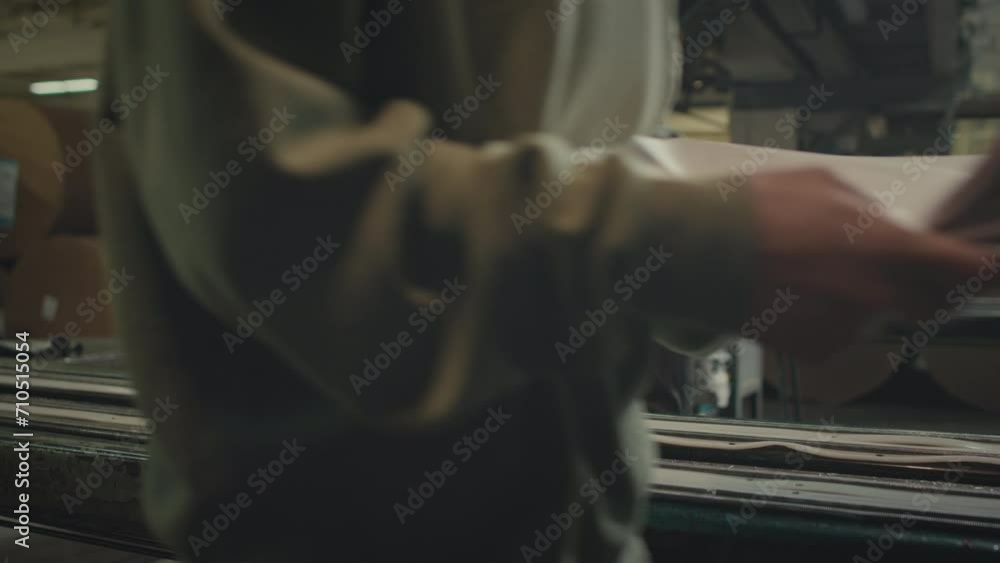 Cropped shot of two unrecognizable women checking just produced fresh paper on production line at printing factoryCropped shot of two unrecognizable women checking just produced fresh paper on product Cropped shot of two unrecognizable women checking just produced fresh paper on production line at printing factoryCropped shot of two unrecognizable women checking just produced fresh paper on product