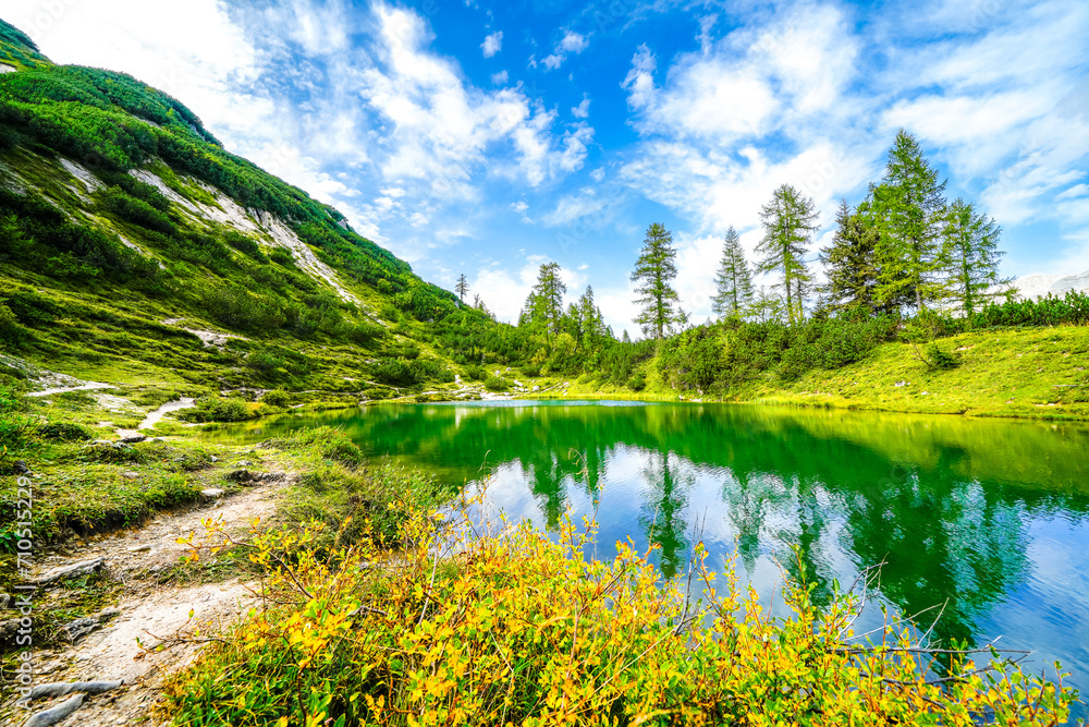 Fairy tale lake on the high plateau of the Tauplitzalm. View of the lake at the Totes Gebirge in Styria. Idyllic landscape with mountains and a lake on the Tauplitz.
