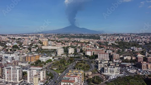 Drone Shot above Catania with smoking Etna in background (Sicily)