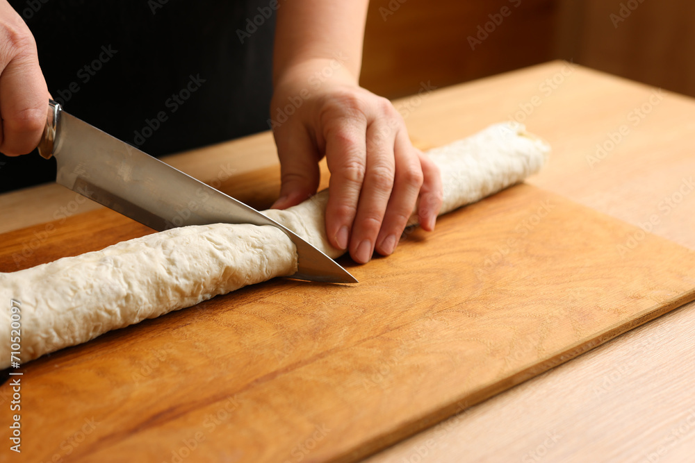 Wrapped in a roll pita bread is cut. Preparation of a roll with cheese, fish and vegetables