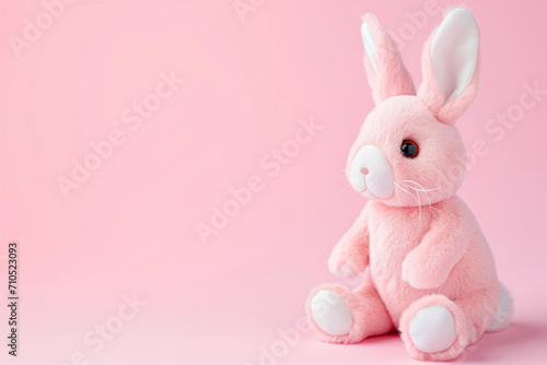 Cute Pastel Pink Easter bunny rabbit soft baby toy with blank empty space for mom-to-be or nursery product or text mockup banner, plain simple natural backdrop background for social media marketing