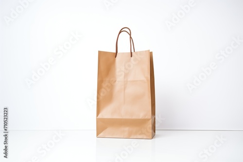plain brown paper bag standing upright on white backdrop