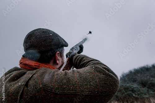 Hunter shooting pheasant photo
