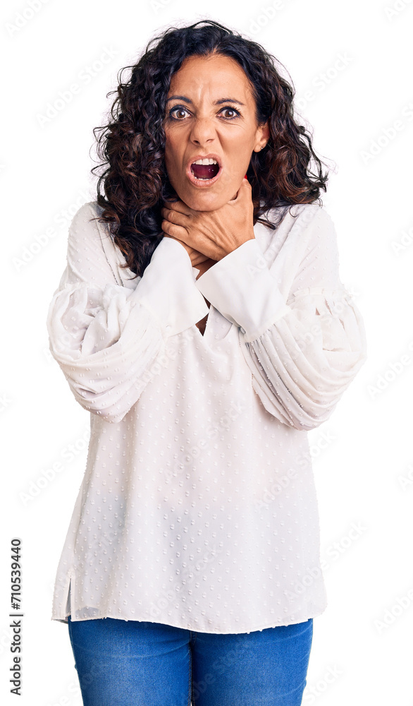 Middle age beautiful woman wearing casual sweater shouting and suffocate because painful strangle. health problem. asphyxiate and suicide concept. Middle age beautiful woman wearing casual sweater shouting and suffocate because painful strangle. health problem. asphyxiate and suicide concept.