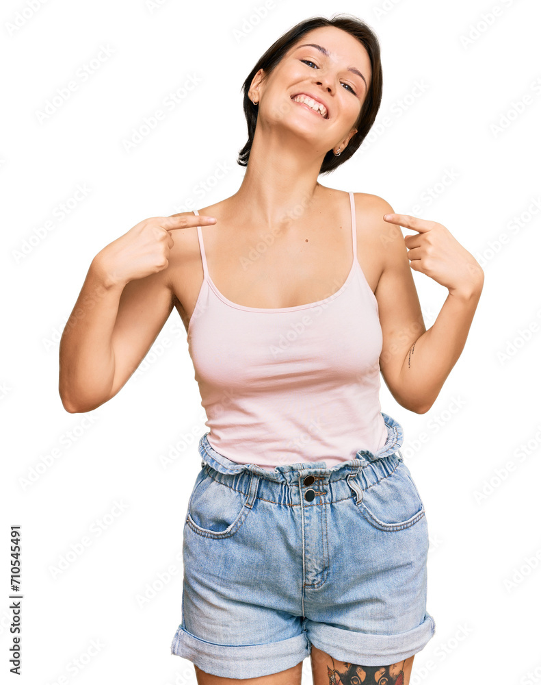 Young brunette woman with short hair wearing casual summer clothes looking confident with smile on face, pointing oneself with fingers proud and happy. Young brunette woman with short hair wearing casual summer clothes looking confident with smile on face, pointing oneself with fingers proud and happy.