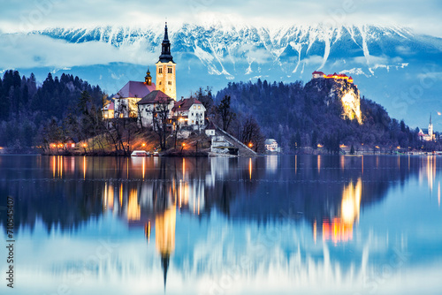 night scenery at Bled lake with church on island . Dramatic , picturesque fall scene. Popular tourist attraction. Bled town, Slovenia, Europe.