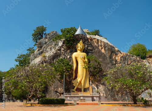A large bas-relief Buddha statue on the cliff. In front of the entrance to Khao Ngu Stone Park, Ratchaburi Province. photo