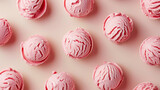 vibrant scoops of strawberry ice cream on a pastel pink background