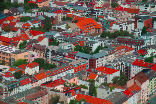 July 1st 2023 - Berlin houses background up view from TV tower. Red, grey and city green urban background.