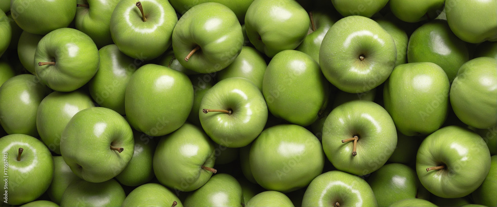 Many fresh green apples stacked together. Many fresh green apples stacked together.