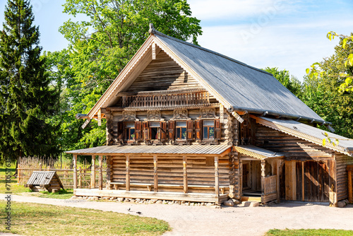 Retro wooden house at the russian village in summer sunny day. Vitoslavlitsy village © Alexandr Blinov