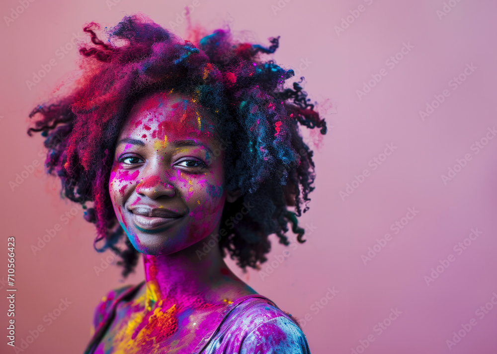 Portrait of Joy and Color african American woman with holi colors on purple background