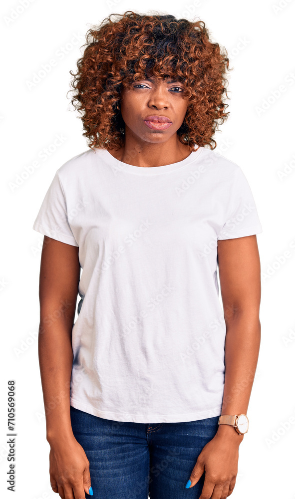 Young african american woman wearing casual white tshirt skeptic and nervous, frowning upset because of problem. negative person. Young african american woman wearing casual white tshirt skeptic and nervous, frowning upset because of problem. negative person.