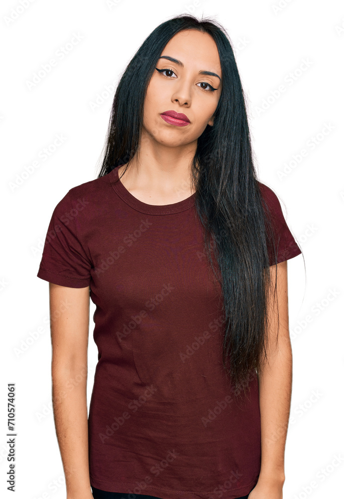 Young hispanic girl wearing casual t shirt relaxed with serious expression on face. simple and natural looking at the camera. Young hispanic girl wearing casual t shirt relaxed with serious expression on face. simple and natural looking at the camera.