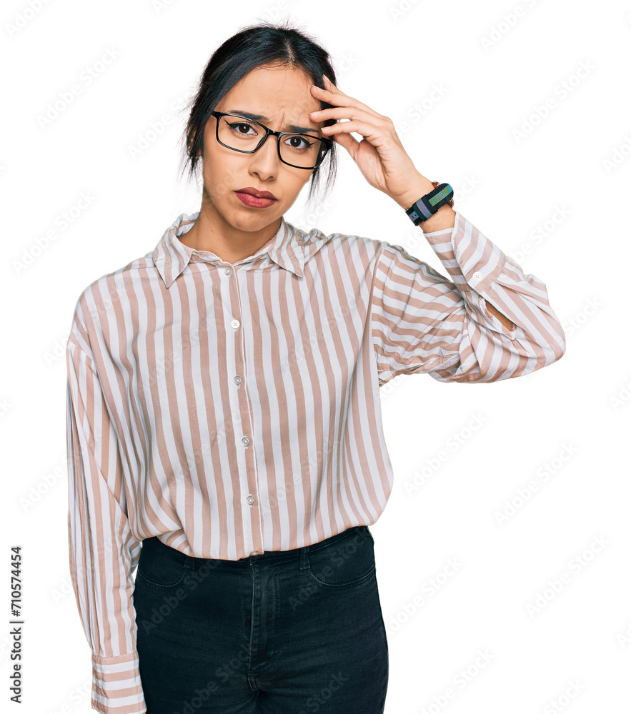 Young hispanic girl wearing casual clothes and glasses worried and stressed about a problem with hand on forehead, nervous and anxious for crisis Young hispanic girl wearing casual clothes and glasses worried and stressed about a problem with hand on forehead, nervous and anxious for crisis