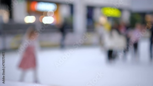 skating session on the indoor ice skating rink in the mall. unrecognizable people. 4k photo