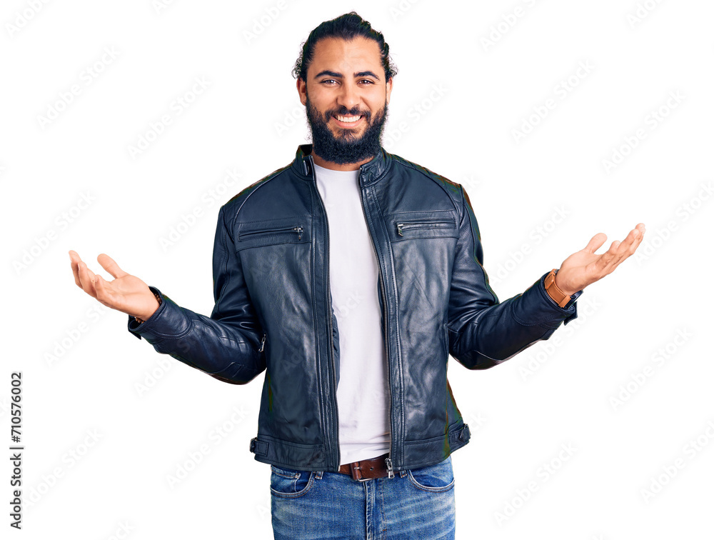 Young arab man wearing casual leather jacket smiling showing both hands open palms, presenting and advertising comparison and balance Young arab man wearing casual leather jacket smiling showing both hands open palms, presenting and advertising comparison and balance