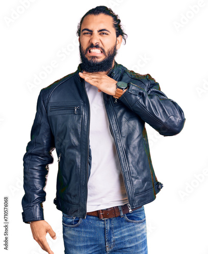 Young arab man wearing casual leather jacket cutting throat with hand as knife, threaten aggression with furious violence photo