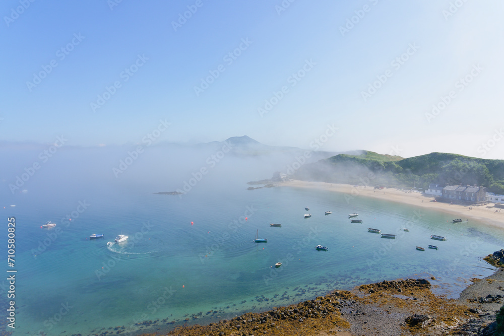 Looking across a foggy Porthdinllaen bay form high on the cliffs. Looking across a foggy Porthdinllaen bay form high on the cliffs.