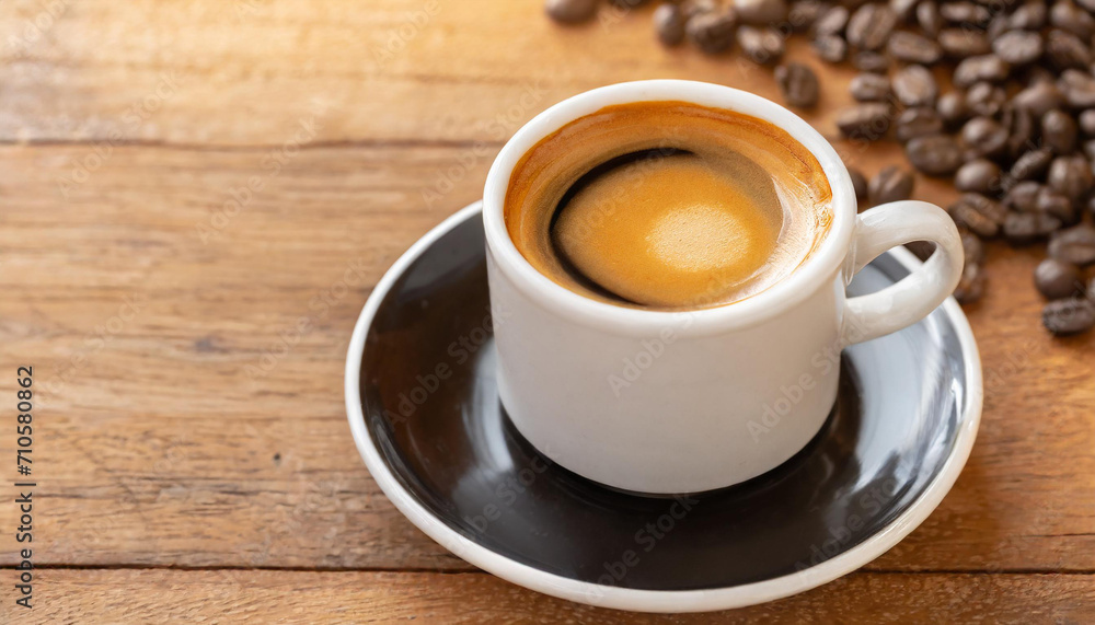 Fototapeta premium Hot espresso on wooden table