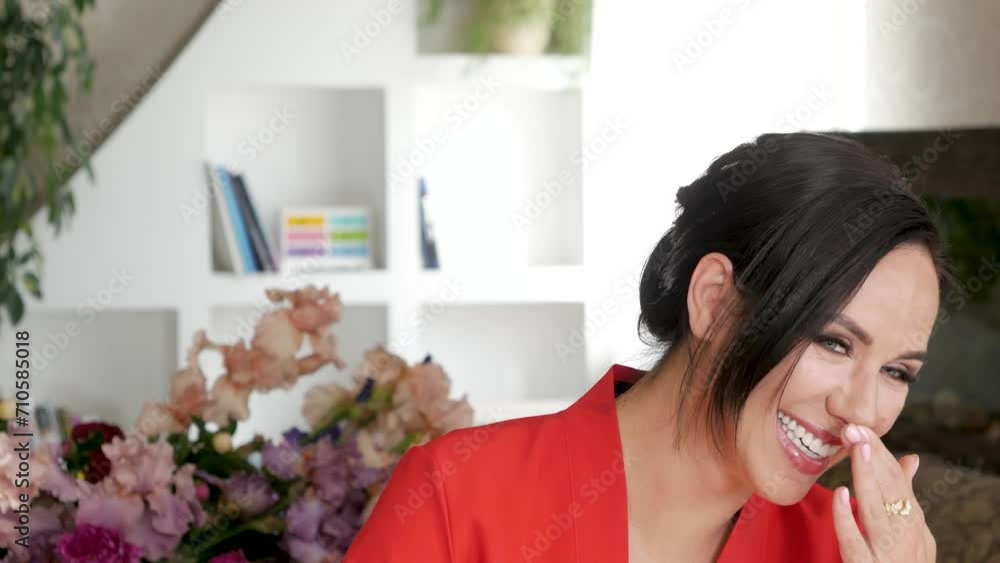 Young female blogger in red dress laughs while shooting Young female blogger in red dress laughs while shooting