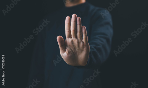 Obraz na płótnie person's hand showing palm gestures stop concepts of violence, warning, refuse, and defense