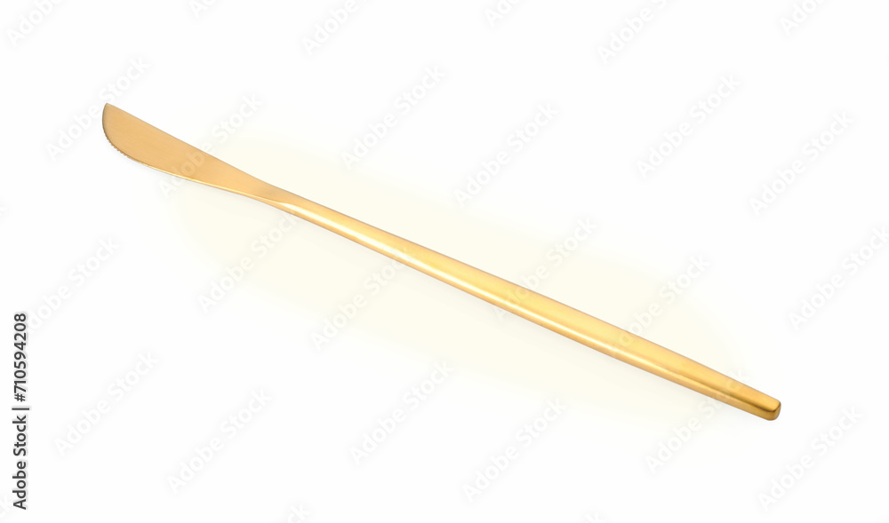 One shiny golden knife isolated on white One shiny golden knife isolated on white