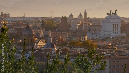 Beautiful Rome in morning lights of sun. Panning shot from Belvedere del Gianicolo. Churches and old town of Rome at sunrise, Italy photo