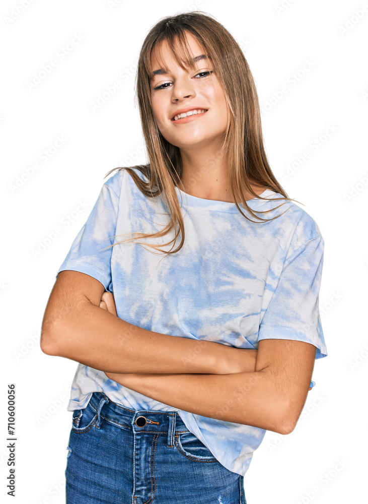 Teenager caucasian girl wearing casual clothes happy face smiling with crossed arms looking at the camera. positive person. Teenager caucasian girl wearing casual clothes happy face smiling with crossed arms looking at the camera. positive person.