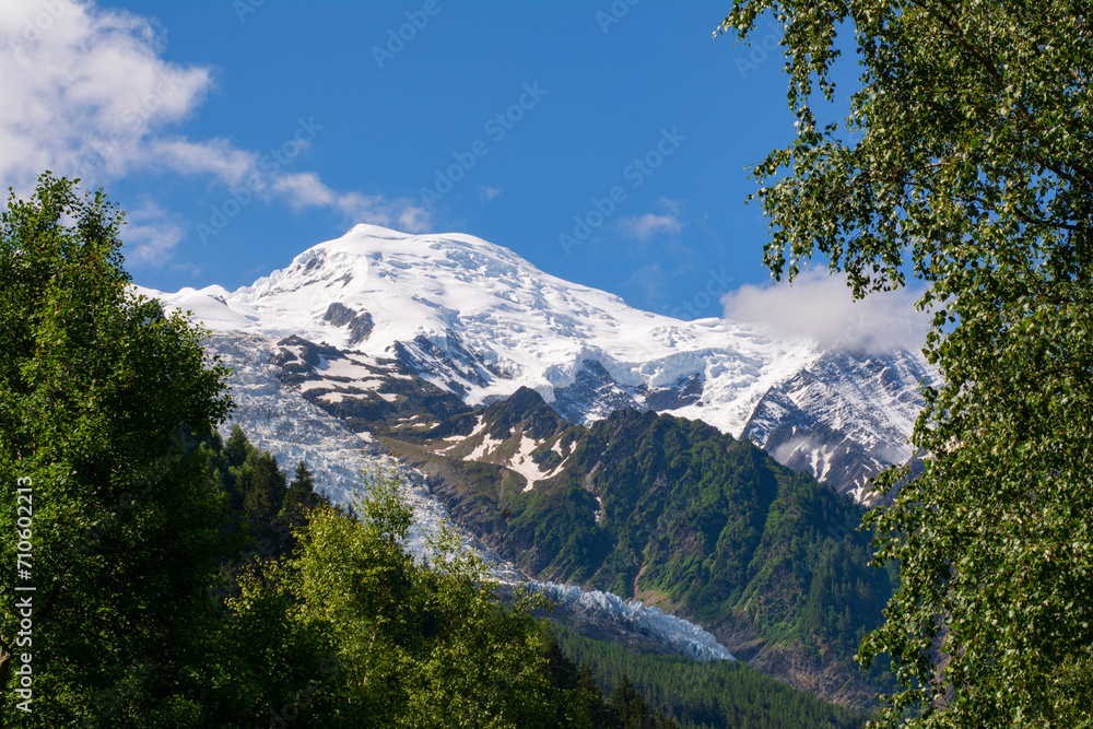 Picturesque view of the Mont Blanc mountain and glacier while hiking Tour du Mont Blanc. Popular tourist attraction. Alps, France, Europe.