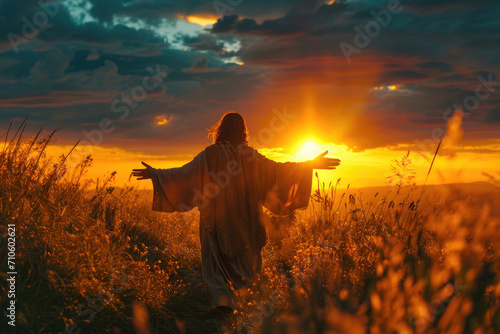Jesus' merciful smile and the setting sun illuminating it photo
