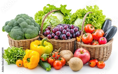 Fresh organic vegetables and fruits in a basket on white background