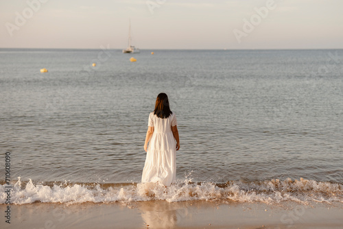 Luxury portrait of woman in white dress at the beach   Algarve  Portugal