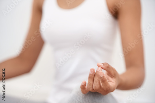 Woman, hands and meditation for yoga, zen or exercise in spiritual wellness or inner peace at home. Closeup of calm female person or yogi meditating in relax for awareness or mental health at house photo