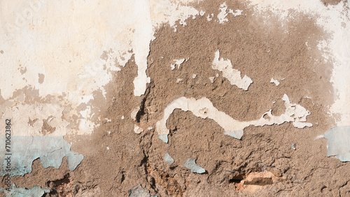 Pared deteriorada de estuco y pintura
