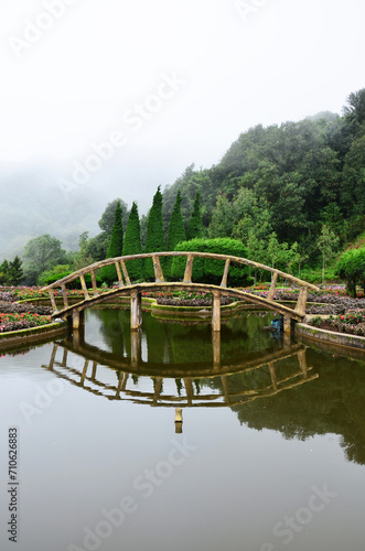 View landscape gardening land garden and wooden bridge pond of Doi Inthanon national park on mountain with mist in morning time for thai people traveler travel visit rest relax in Chiang Mai, Thailand
