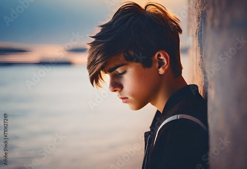 sad teenager boy on minimal background psychological therapy   photo
