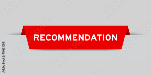 Red color inserted label with word recommendation on gray background