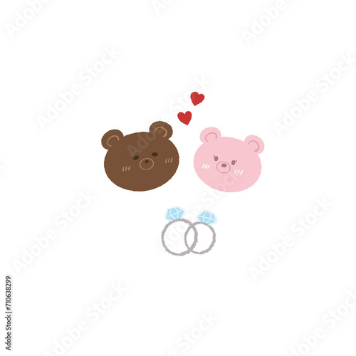 Two teddy bears and two diamond engagement rings in love at a wedding
