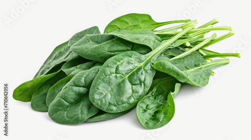 A pile of spinach leaves on a white surface. Suitable for food, healthy eating, and vegetarian themes