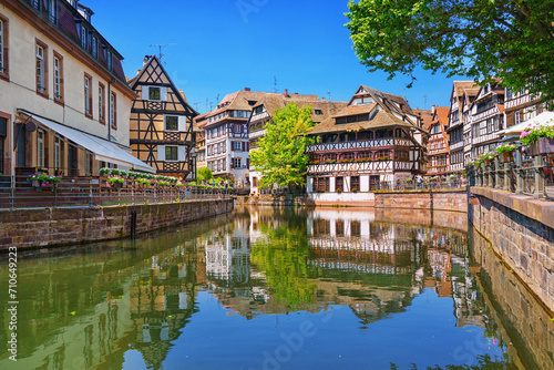 Alsace, France. Traditional half-timbered houses on the canals district La Petite France in Strasbourg in summer. UNESCO World heritage site.