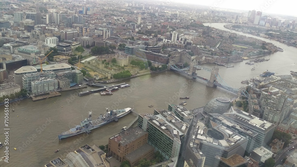Aerial view of London's cityscape with river and buildings.