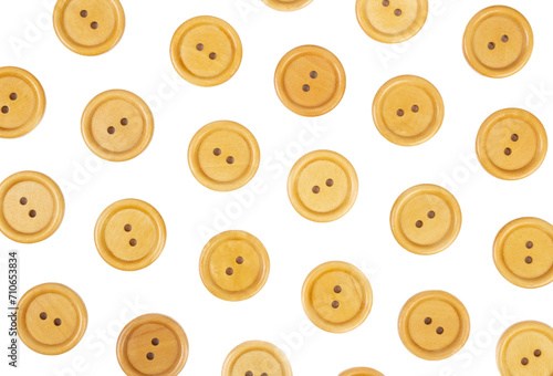 White background of wooden  round buttons © Valeria F