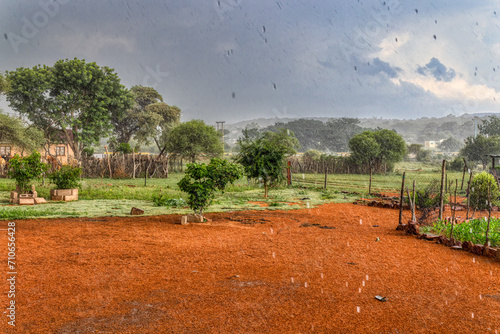 africa rainy season in the village torrential rain view from the yard, village inn botswana photo