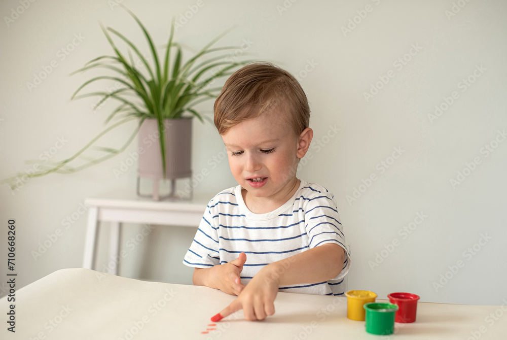 Caucasian Little Boy Painting with Colorful Hands Paints at Home Early Education Preparing for School Preschool Development Children Game Caucasian Little Boy Painting with Colorful Hands Paints at Home Early Education Preparing for School Preschool Development Children Game
