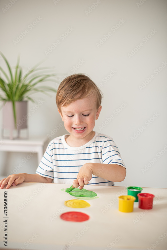 Caucasian Little Boy Painting with Colorful Hands Paints at Home Early Education Preparing for School Preschool Development Children Game Caucasian Little Boy Painting with Colorful Hands Paints at Home Early Education Preparing for School Preschool Development Children Game