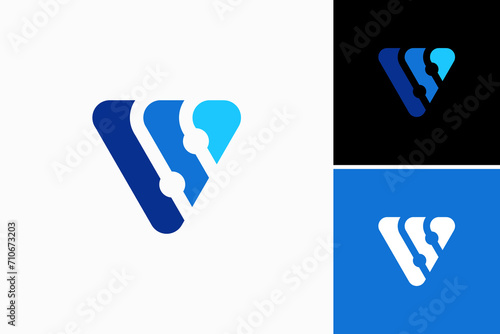 letter V  and circuit board Vector Logo Premium photo
