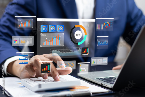 Analyst utilizing technology and dashboard with charts data science and Big Data technology for business, Strategic data management system with KPI organization performance with technology and metrics photo